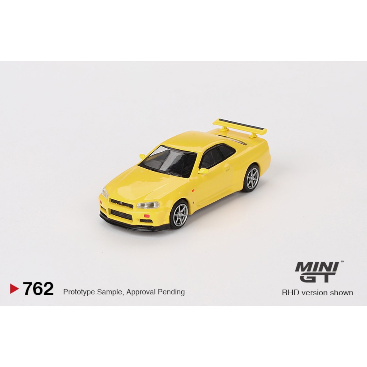 Mini GT - Nissan Skyline GT-R (R34) V-Spec Lightning Yellow - MGT00762 (RHD) - 1:64