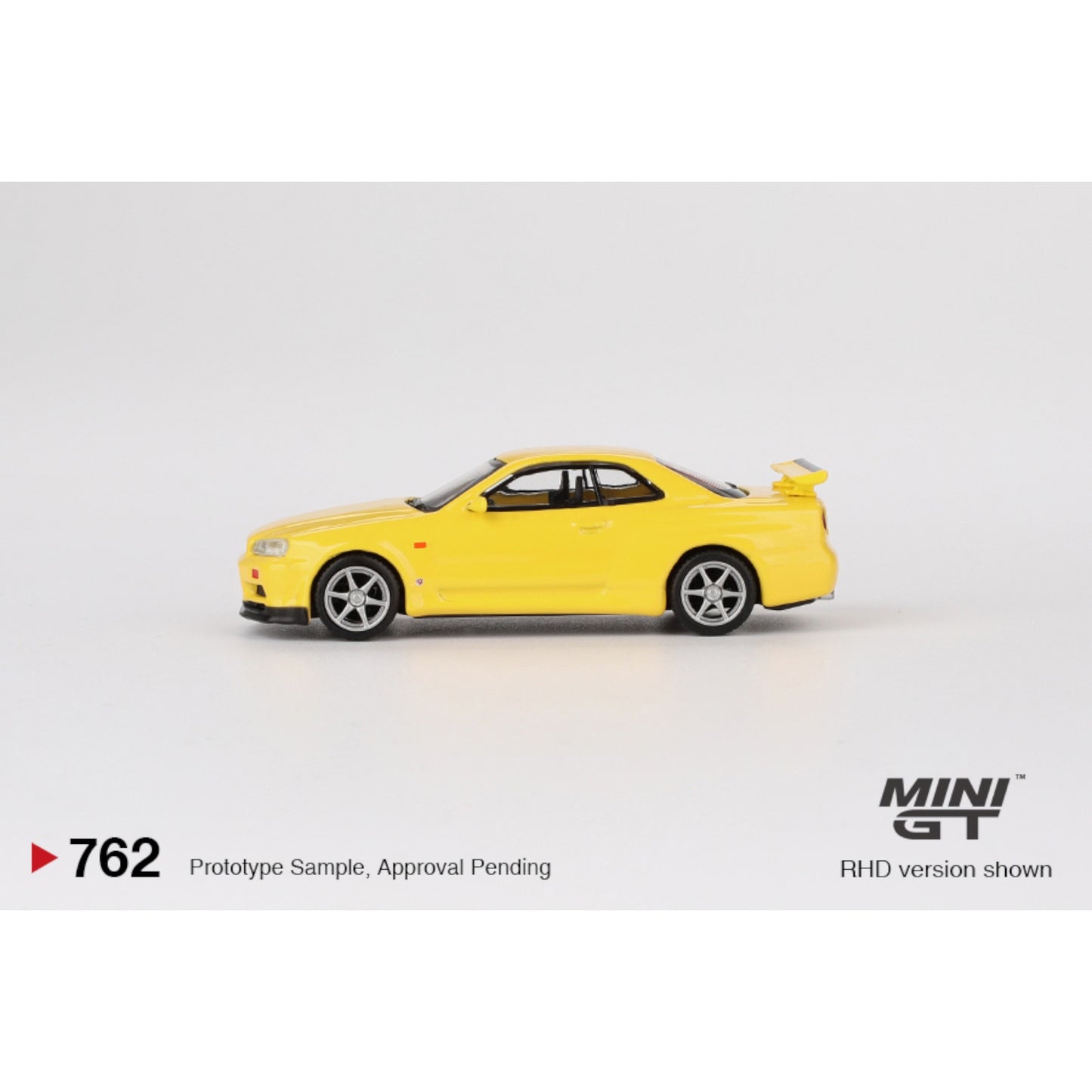Mini GT - Nissan Skyline GT-R (R34) V-Spec Lightning Yellow - MGT00762 (RHD) - 1:64