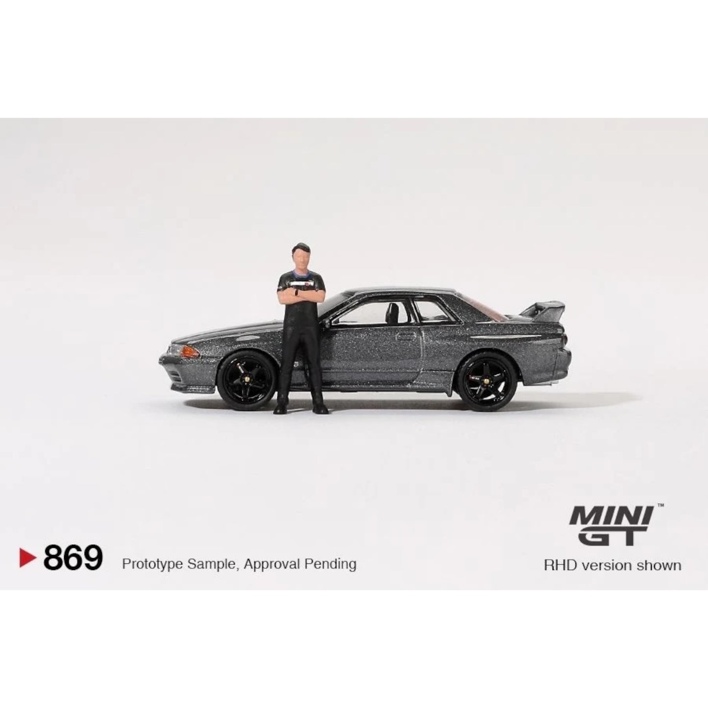 Mini GT - Pre-Order - Nissan Skyline GT-R (R32) Nismo Gunmetal W/ Matsuda Figure - MGT00869 (RHD)