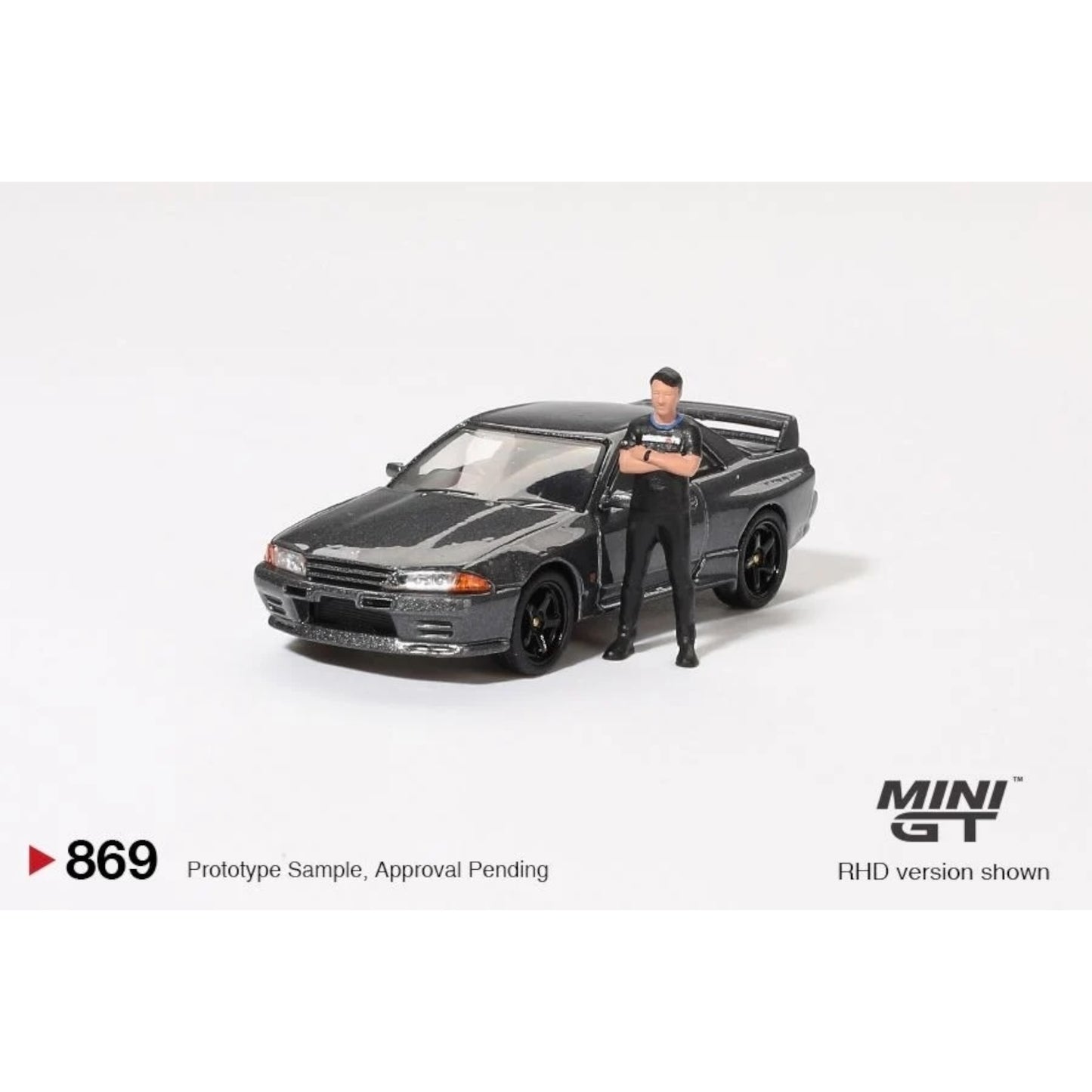 Mini GT - Pre-Order - Nissan Skyline GT-R (R32) Nismo Gunmetal W/ Matsuda Figure - MGT00869 (RHD)