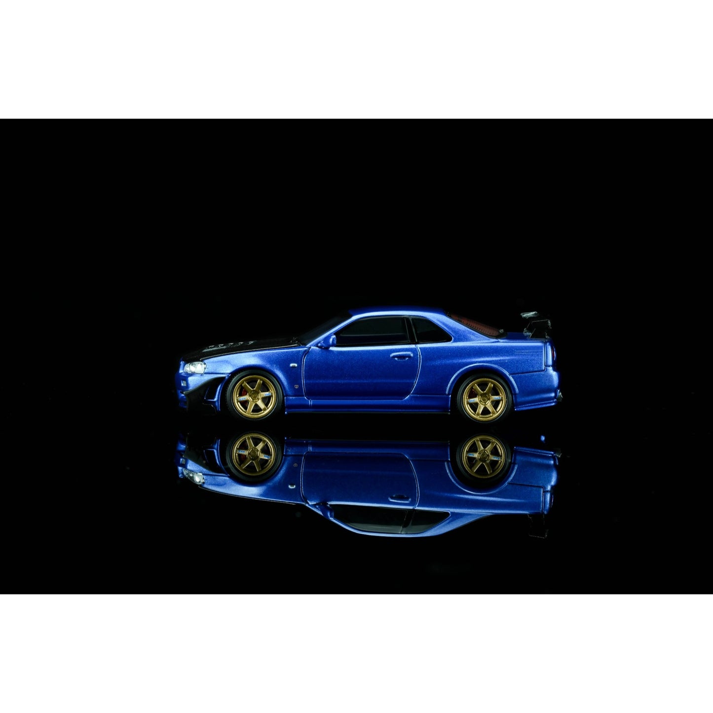 Motorhelix - Pre-Order - Nissan Skyline GT-R (R34) Customized with GT Aero Kit, bayside blue - M63476
