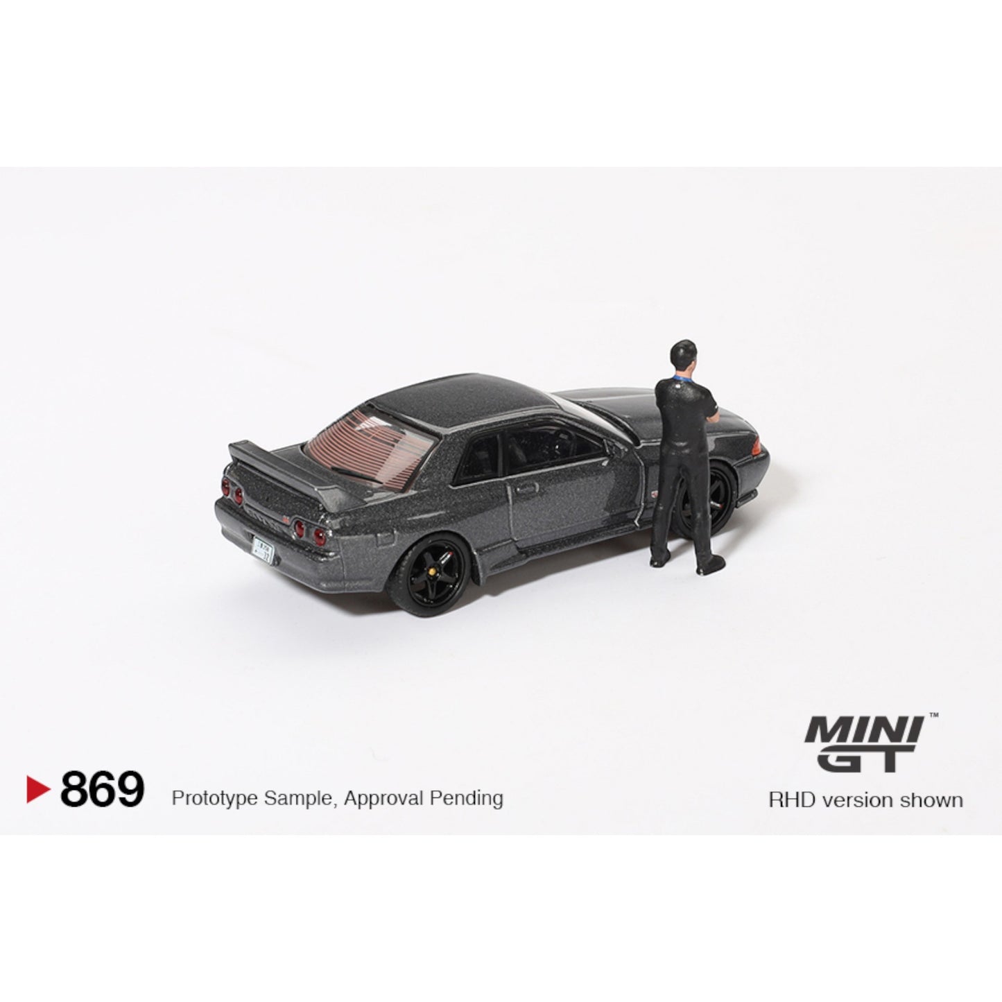 Mini GT - Nissan Skyline GT-R (R32) Nismo Gunmetal W/ Matsuda Figure - MGT00869 (RHD)