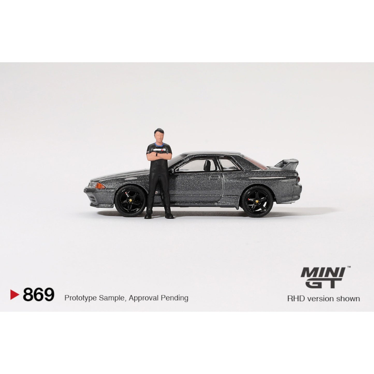 Mini GT - Nissan Skyline GT-R (R32) Nismo Gunmetal W/ Matsuda Figure - MGT00869 (RHD)